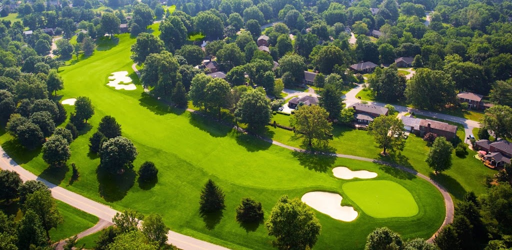 Panoramic view of a lush green golf course at Hunting Creek Country Club. Smooth