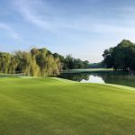 Panoramic view of a lush green golf course at Huntsville Country Club. Smooth