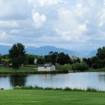 Panoramic view of a lush green golf course at Hyland Hills Golf Course. Smooth