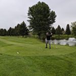green grass with the flag in the hole.