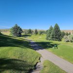 Panoramic view of a lush green golf course at Idaho Falls Country Club. Smooth