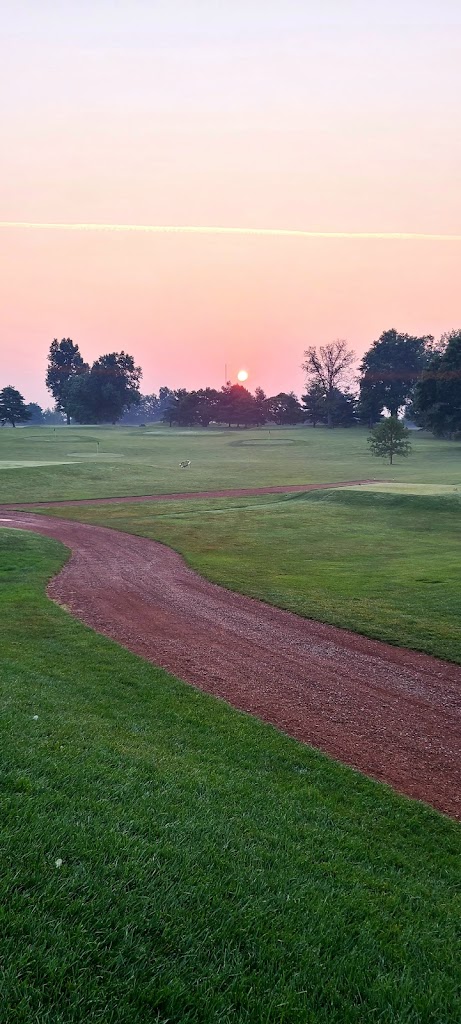 Panoramic view of a lush green golf course at Idle Hour Country Club. Smooth
