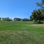 Panoramic view of a lush green golf course at Indian Creek Golf Club. Smooth