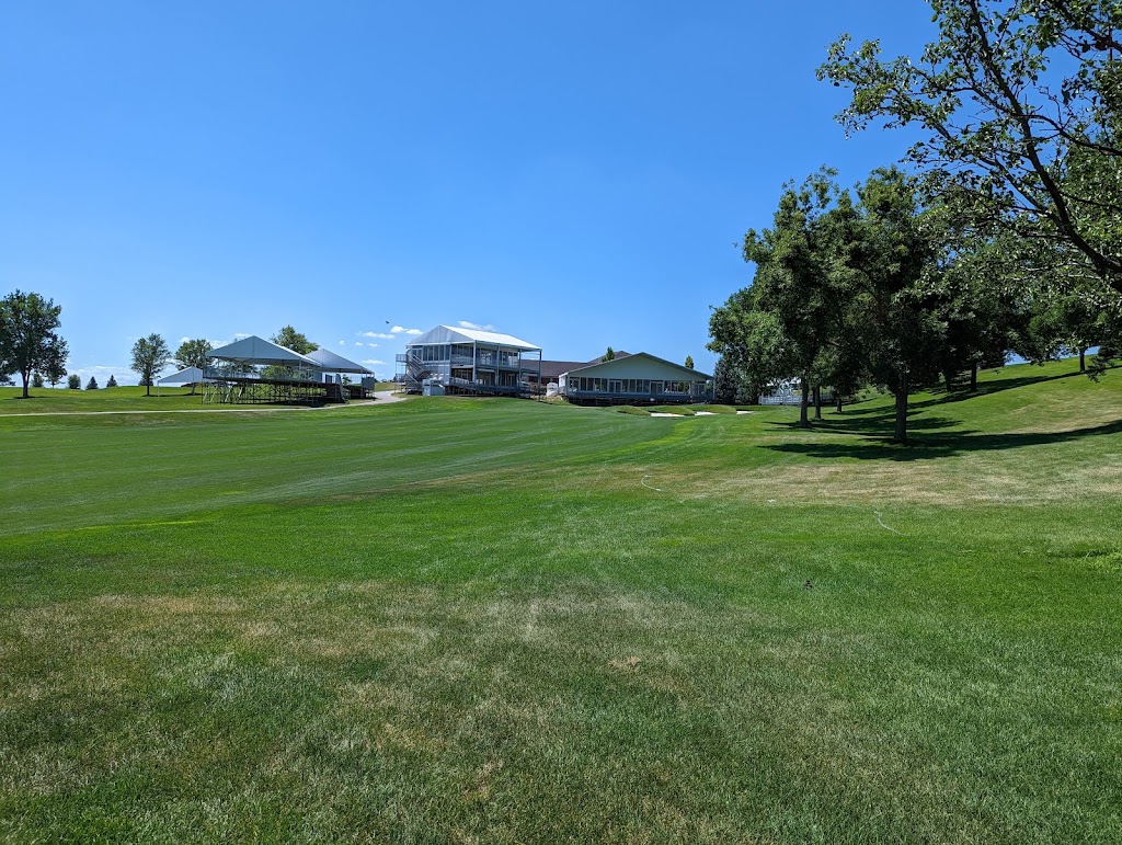 Panoramic view of a lush green golf course at Indian Creek Golf Club. Smooth