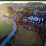 Panoramic view of a lush green golf course at Indian Hills Country Club. Smooth