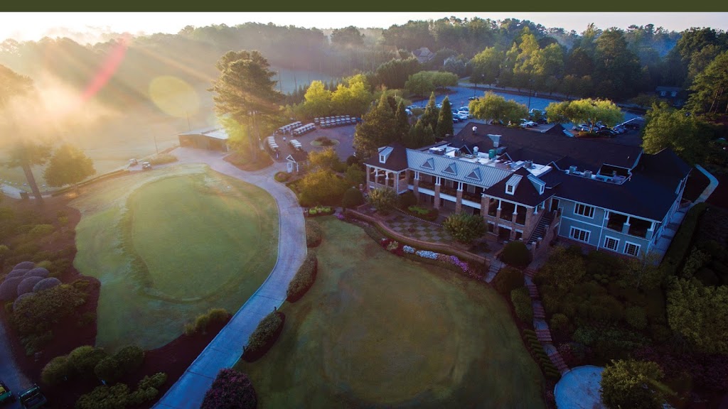 Panoramic view of a lush green golf course at Indian Hills Country Club. Smooth
