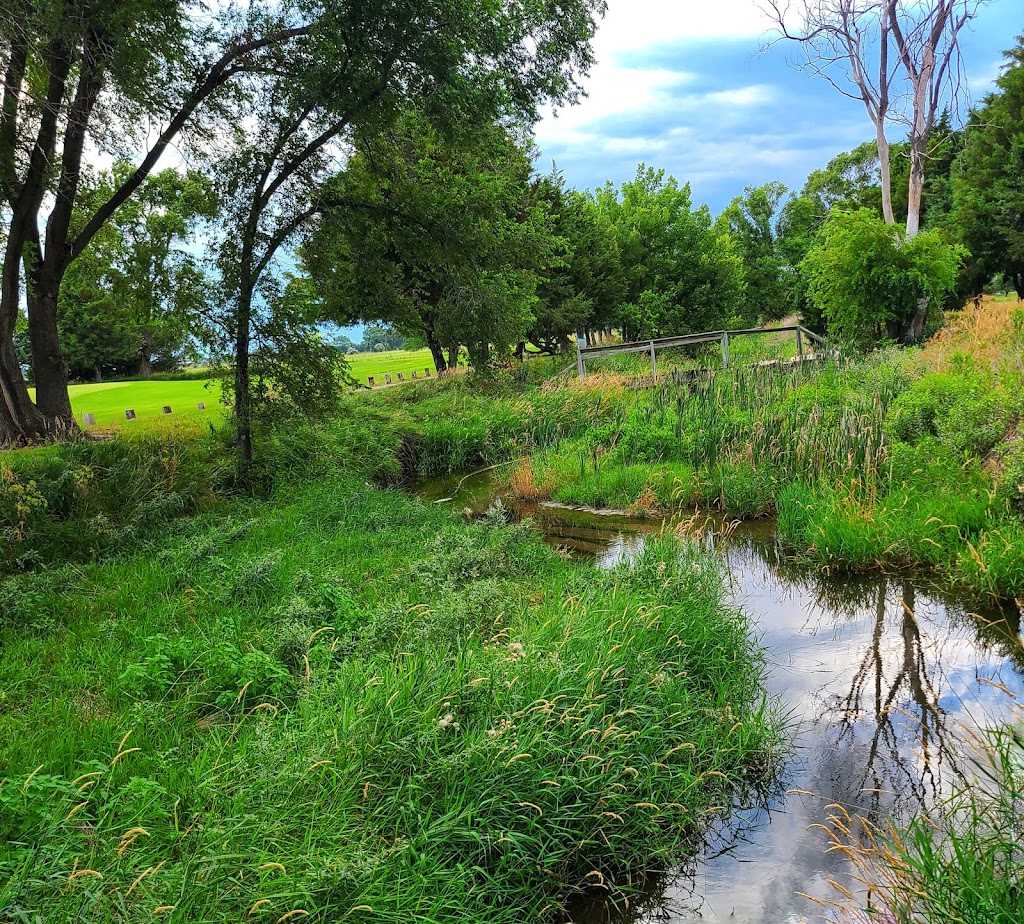 Panoramic view of a lush green golf course at Indian Meadows Golf Course. Smooth
