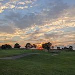 Panoramic view of a lush green golf course at Indian Ridge Golf Club. Smooth
