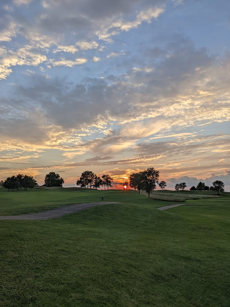 Panoramic view of a lush green golf course at Indian Ridge Golf Club. Smooth