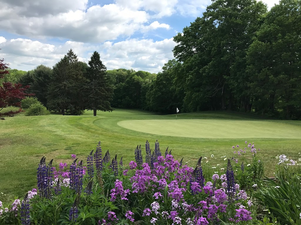 Panoramic view of a lush green golf course at Indian Springs Golf Club. Smooth