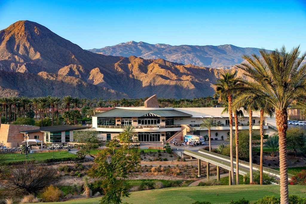 Panoramic view of a lush green golf course at Indian Wells Golf Resort. Smooth