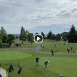 green grass with the flag in the hole.