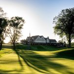 Panoramic view of a lush green golf course at Interlachen Country Club. Smooth