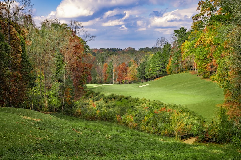 Panoramic view of a lush green golf course at Iron Horse Golf Club. Smooth
