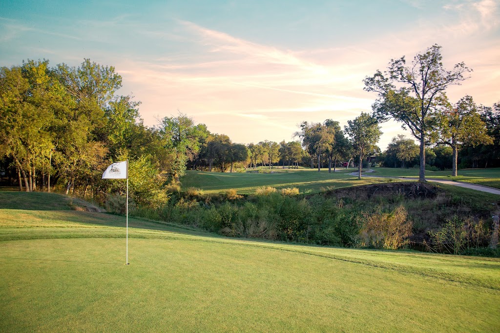 Panoramic view of a lush green golf course at Iron Horse Golf Course. Smooth