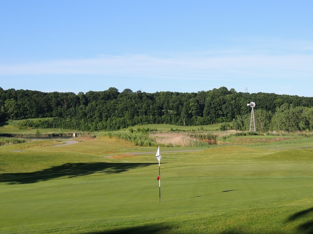 Panoramic view of a lush green golf course at Iron Valley Golf Club. Smooth