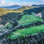 Panoramic view of a lush green golf course at Ironbridge Golf Club. Smooth