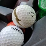 green grass with the flag in the hole.