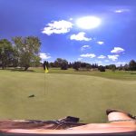 green grass with the flag in the hole.