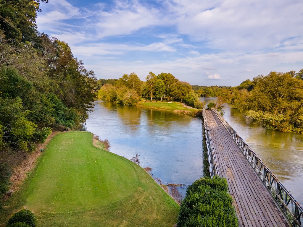 Panoramic view of a lush green golf course at Island Pointe Golf Club. Smooth