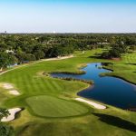Panoramic view of a lush green golf course at Jacaranda Golf Club. Smooth