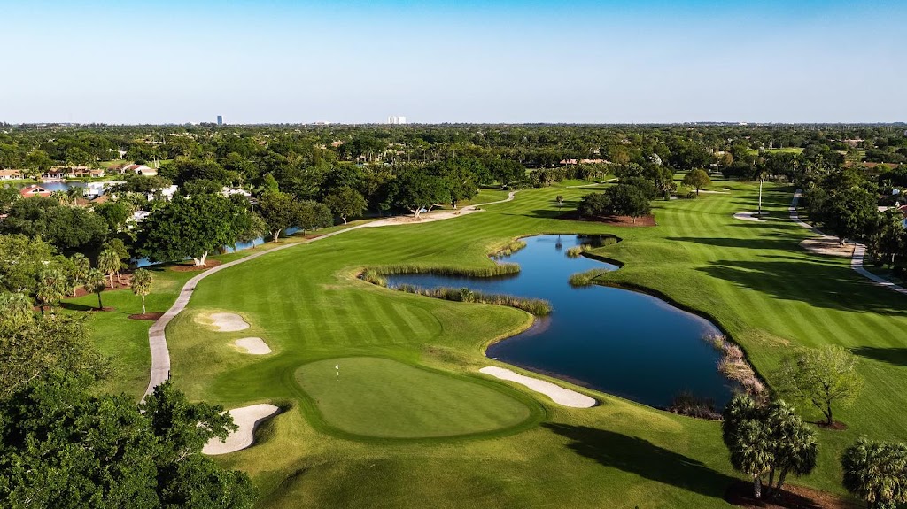 Panoramic view of a lush green golf course at Jacaranda Golf Club. Smooth