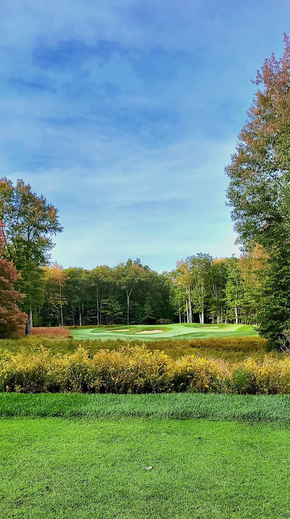 Panoramic view of a lush green golf course at Jack Frost National Golf Club. Smooth