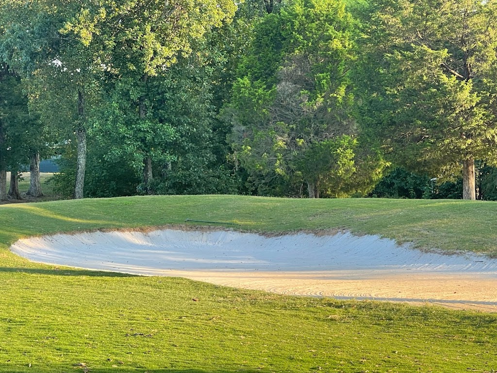 Panoramic view of a lush green golf course at Jackson National Golf Club. Smooth