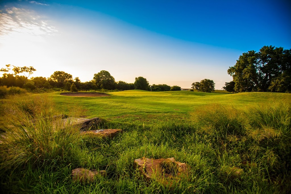 Panoramic view of a lush green golf course at James E Stewart Golf Course. Smooth