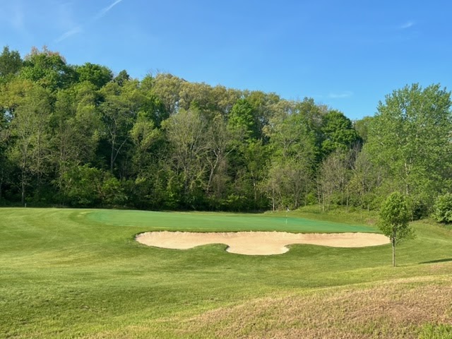 Panoramic view of a lush green golf course at Jasper Hills Golf Club. Smooth