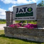 Panoramic view of a lush green golf course at Jato Highlands Golf Course. Smooth