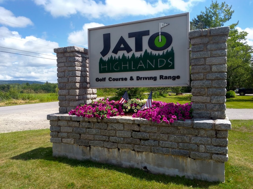 Panoramic view of a lush green golf course at Jato Highlands Golf Course. Smooth