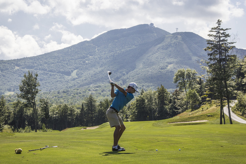 Panoramic view of a lush green golf course at Jay Peak Resort Golf Course. Smooth
