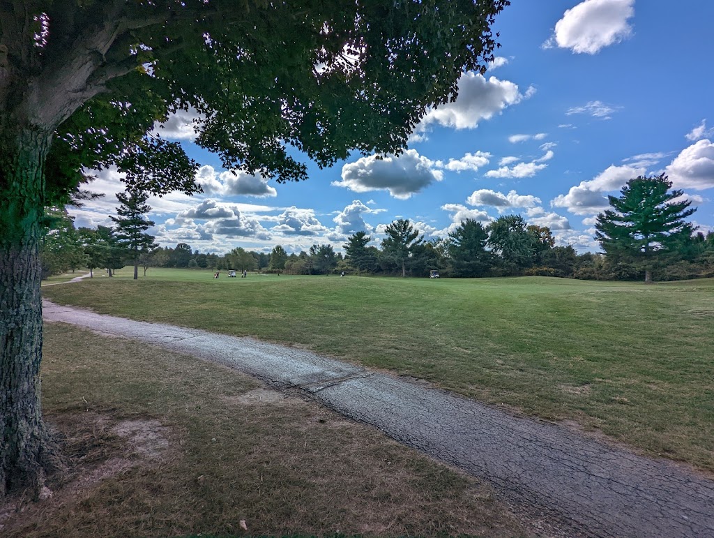 Panoramic view of a lush green golf course at Jaycee Public Golf Course. Smooth