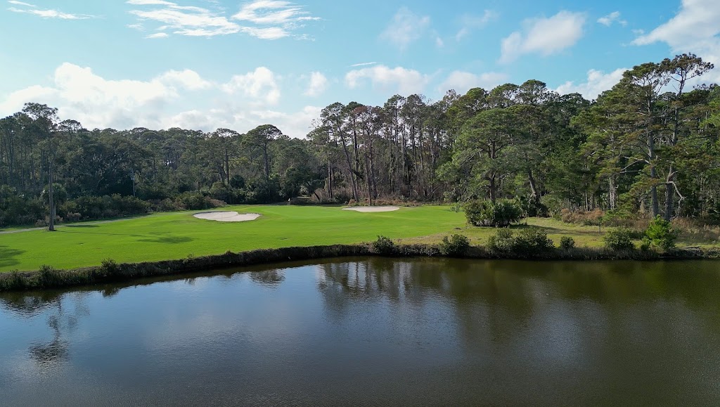 Panoramic view of a lush green golf course at Jekyll Island Golf Club. Smooth