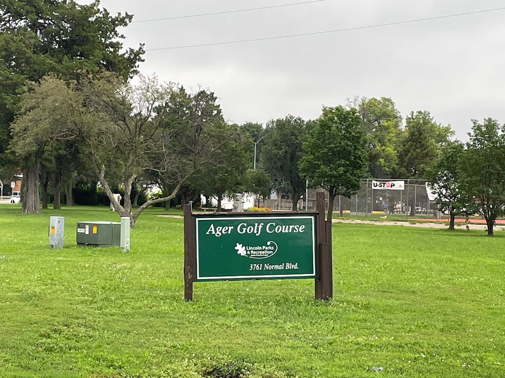 Panoramic view of a lush green golf course at Jim Ager Golf Course. Smooth