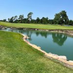 Panoramic view of a lush green golf course at Jimmie Austin OU Golf Club. Smooth