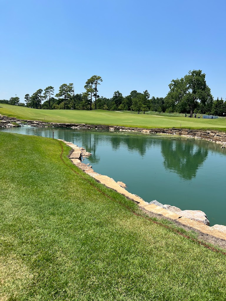 Panoramic view of a lush green golf course at Jimmie Austin OU Golf Club. Smooth