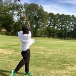 green grass with the flag in the hole.