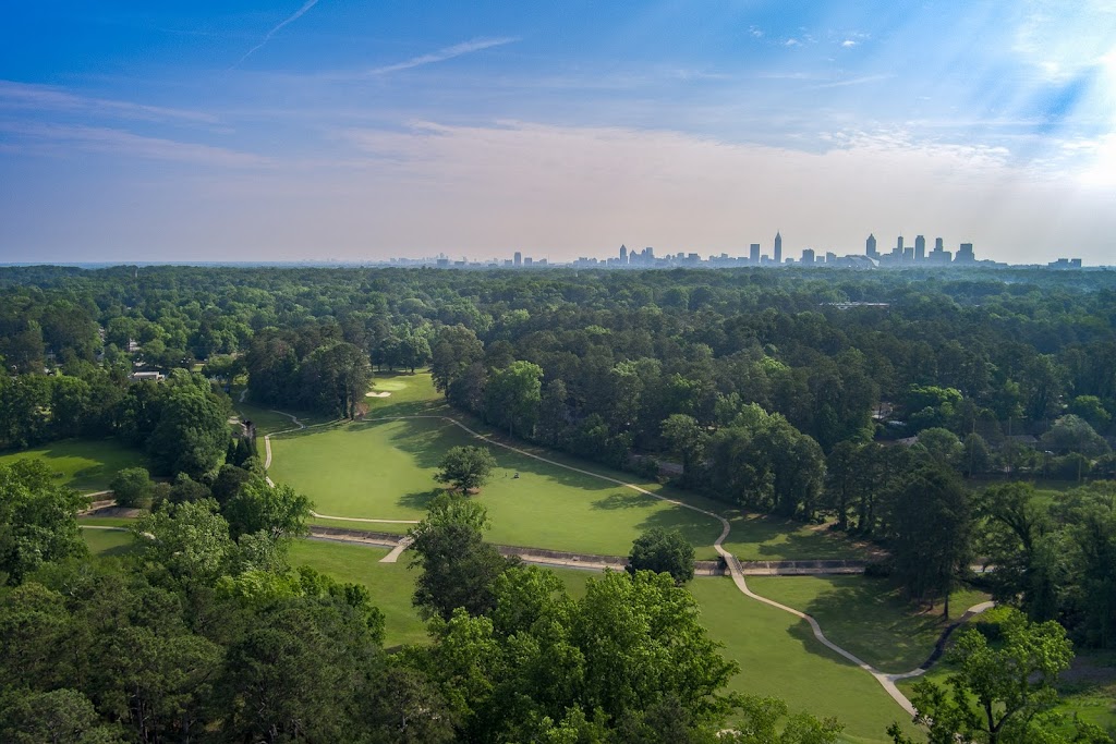 Panoramic view of a lush green golf course at John A. White Golf Course. Smooth