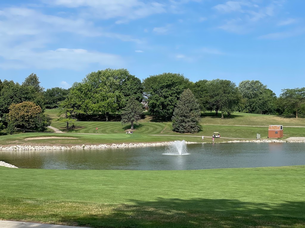 Panoramic view of a lush green golf course at Johnny Goodman Golf Course. Smooth