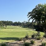 Panoramic view of a lush green golf course at Juliette Falls Golf Course and Community. Smooth
