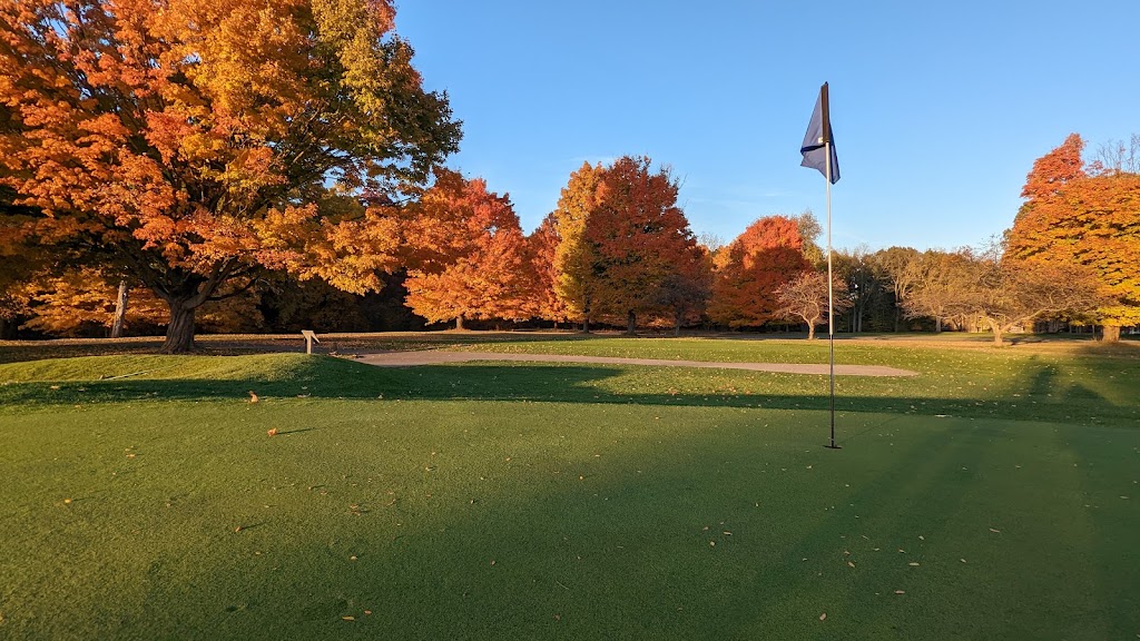 Panoramic view of a lush green golf course at Kaufman Golf Course. Smooth