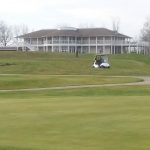 green grass with the flag in the hole.