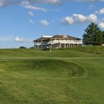 Panoramic view of a lush green golf course at Kearney Hill Golf Links. Smooth