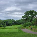 Panoramic view of a lush green golf course at Keller Golf Course. Smooth