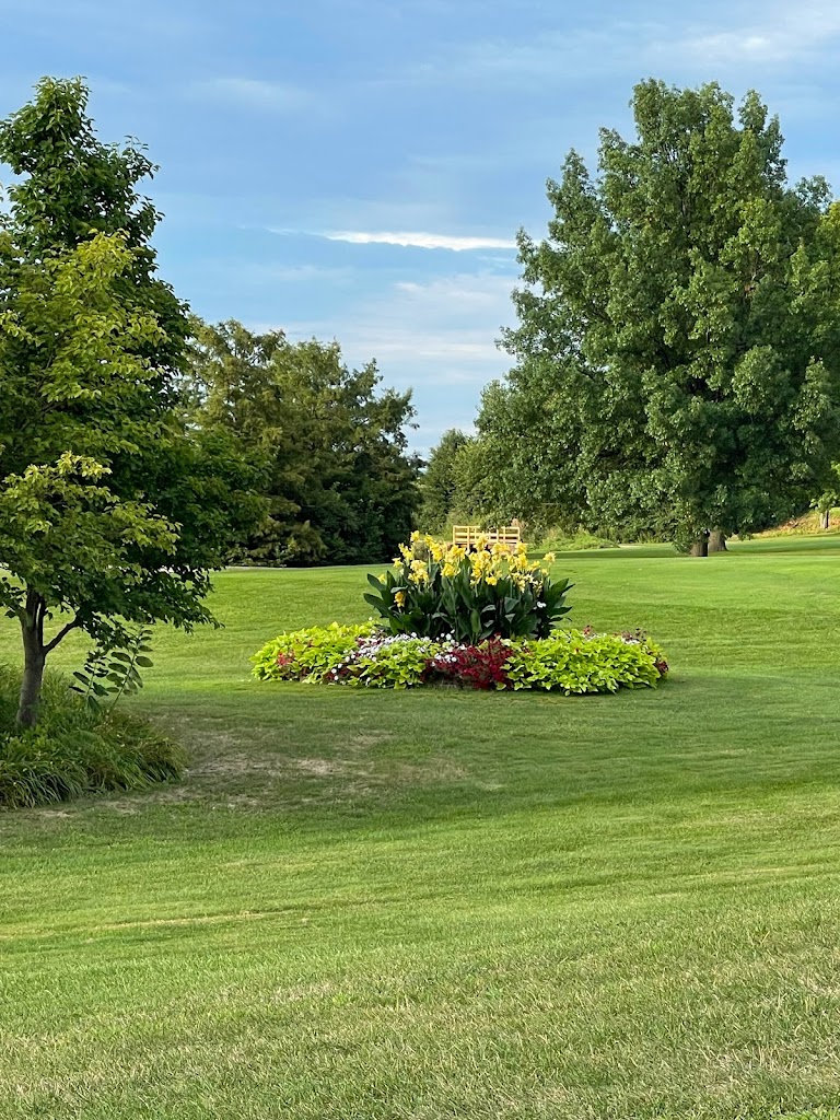 Panoramic view of a lush green golf course at Kellogg Golf Course. Smooth