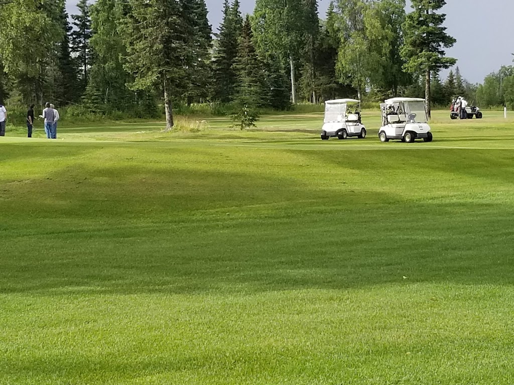 Panoramic view of a lush green golf course at Kenai Golf Course. Smooth