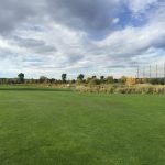 Panoramic view of a lush green golf course at Kennedy Golf Course. Smooth