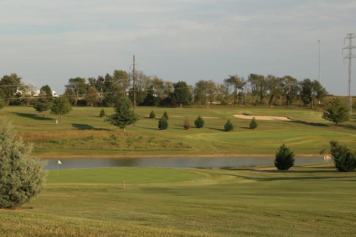 Panoramic view of a lush green golf course at Kenny Perry's Country Creek Golf Course. Smooth